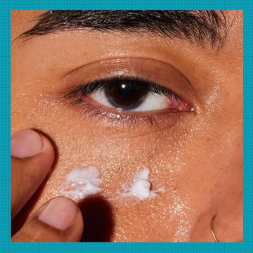 Eye care products displayed alongside a person applying cream under their eye.