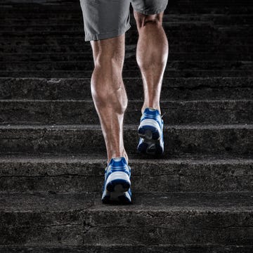 close up of young man running up the stairs